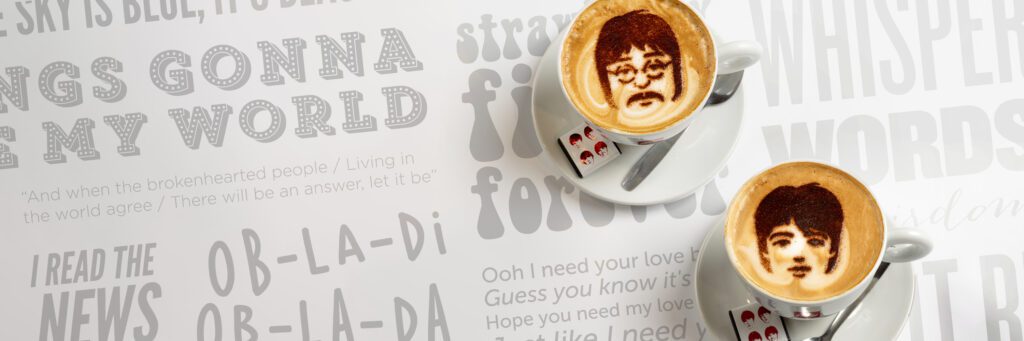 Coffees showing faces of John and Paul in chocolate from The Fab4 Cafe at The Beatles Story Museum in Liverpool