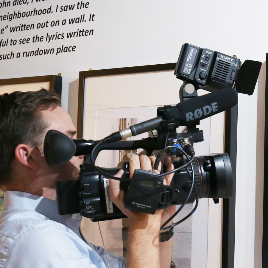 Cameraman taking video footage at The Beatles Story Museum