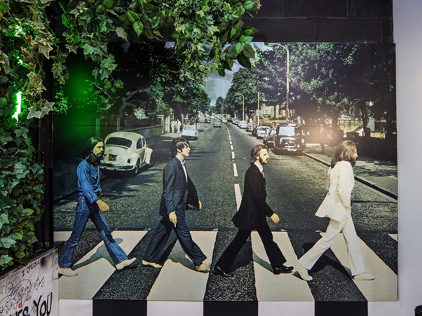 the cover art of abbey road by the beatles on display at the beatles story, liverpool