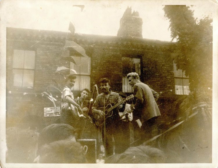 An old photo of The Quarrymen performing in Liverpool.