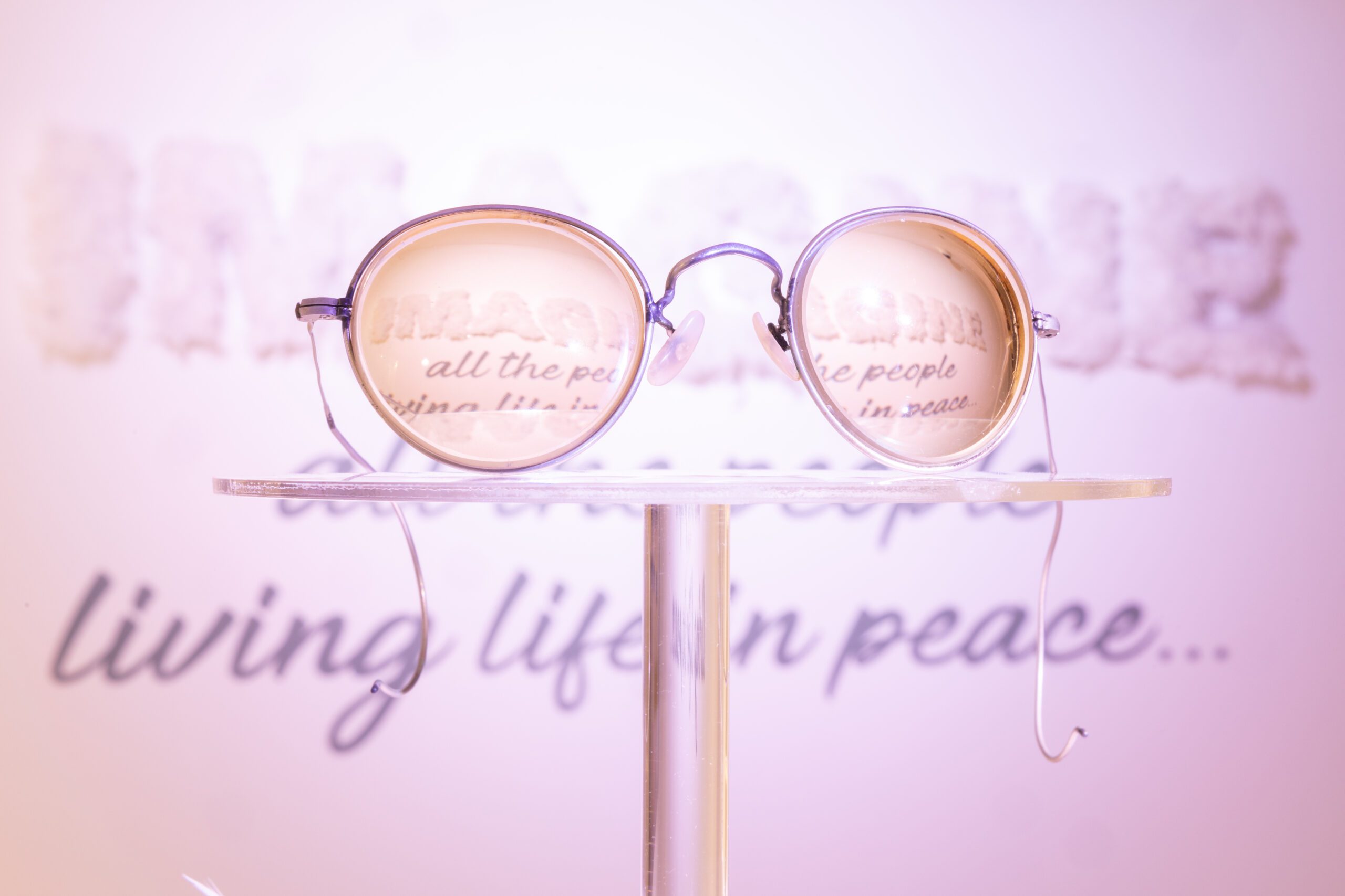 John Lennon's spectacles on display in the white room exhibit, The Beatles Story.