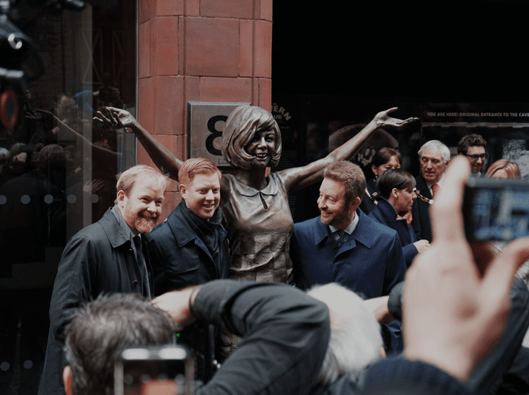 Cilla Black’s sons (left to right) Ben, Jack, and Robert Willis stand beside her statue during its unveiling outside Liverpool’s Cavern Club.