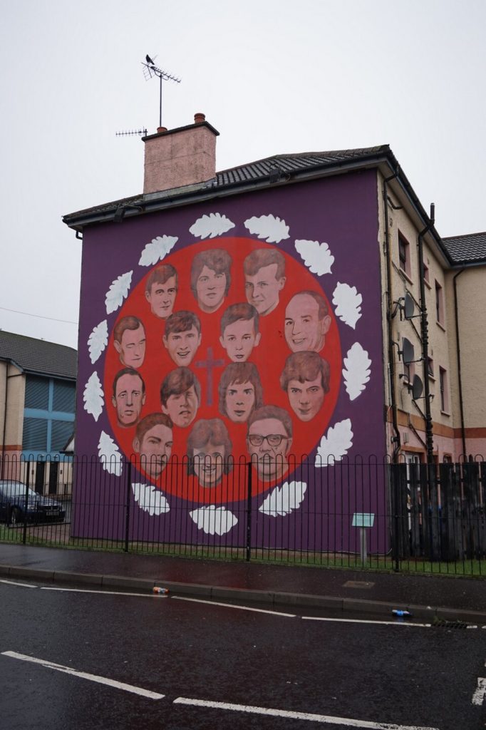 A mural commemorating the victims of Bloody Sunday, Derry. Photo by Ian S., via Wikimedia Commons (CC BY-SA [licence version])