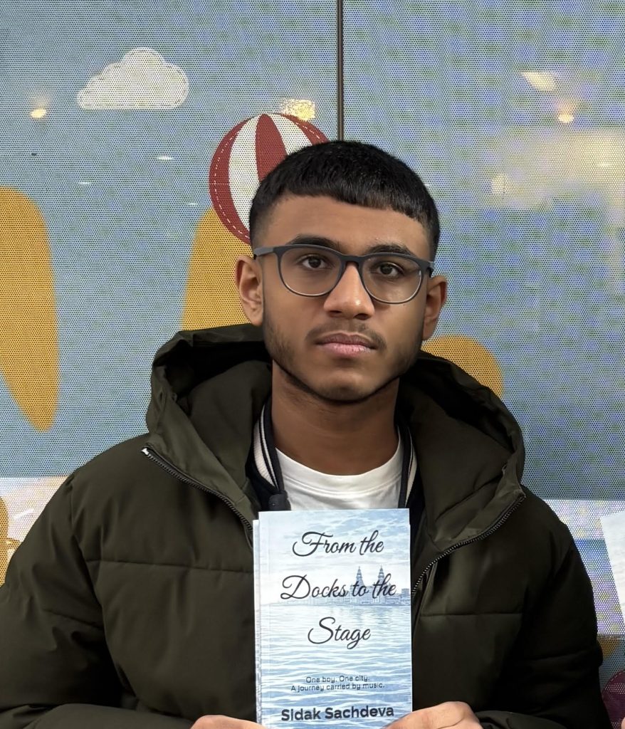 Sidak Sachdeva with his book From the Docks to the Stage.